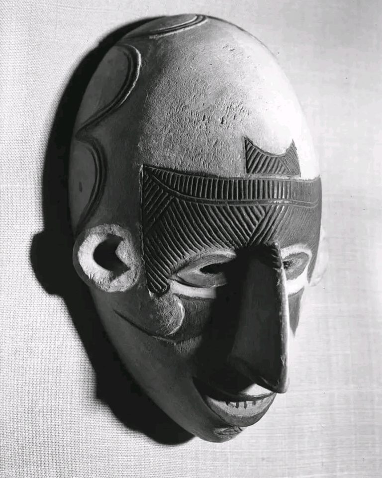 Nri-Awka white female face mask with itchi scarring, 1937. Pitt Rivers Museum. University of Oxford