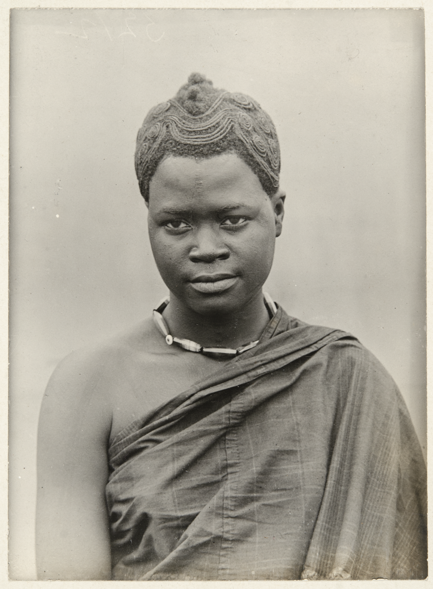 Igbo woman with elaborate geometric hairstyle, c 1910.