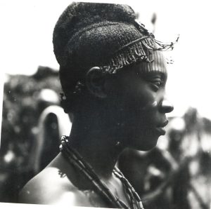 Young Igbo Man with Traditional plaited Hairstyle and Neck Beads, circa 1880-1939.